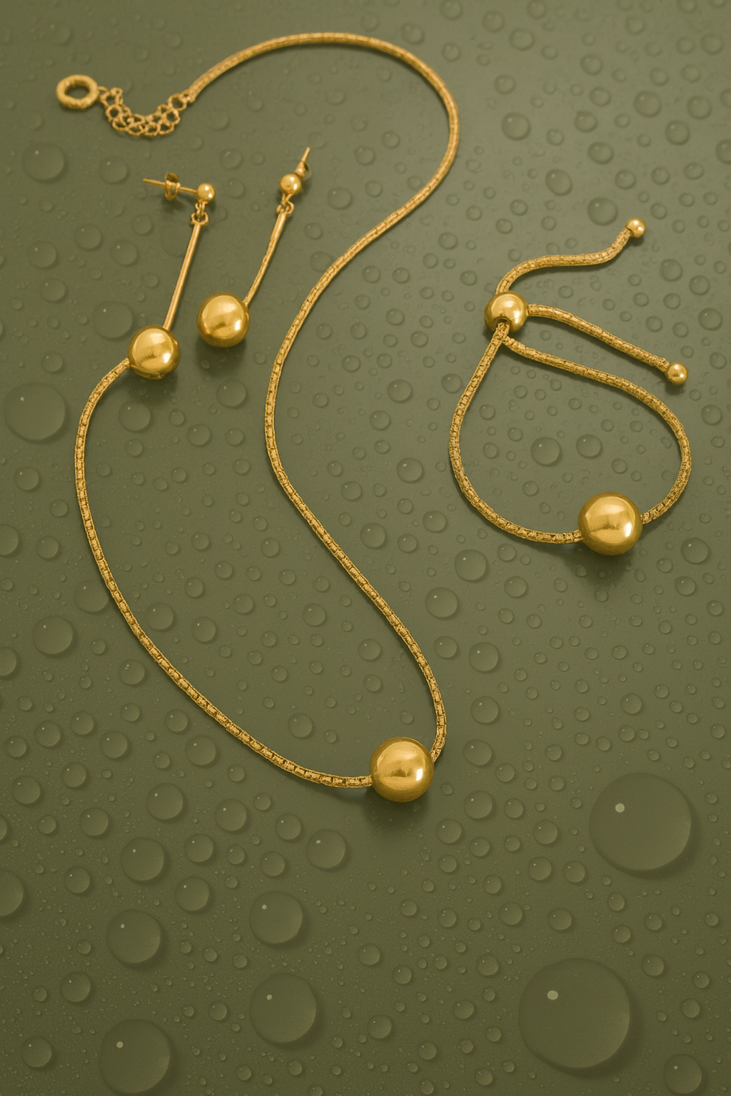 Pendientes Esfera Largos — Plata de ley bañada en oro 18k. Acabado pulido.