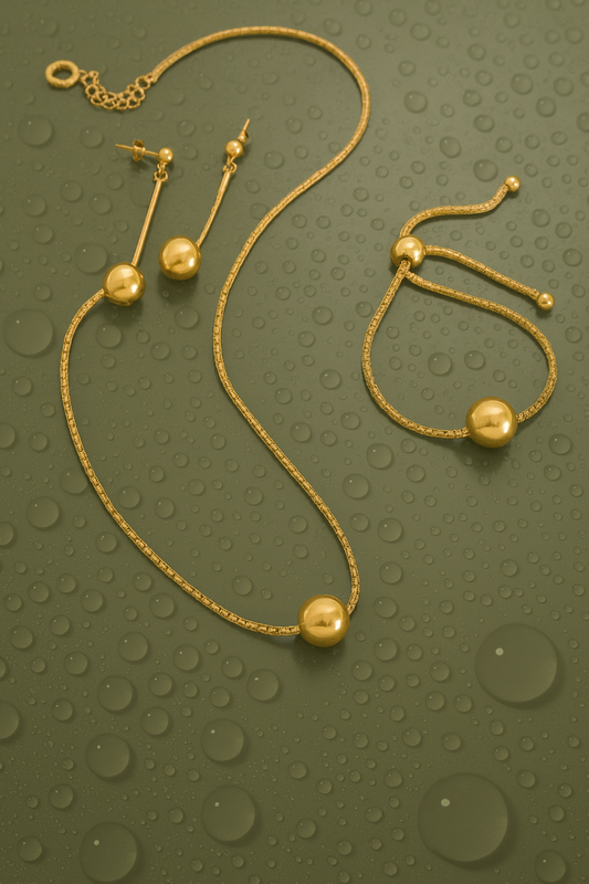 Pendientes Esfera Largos — Plata de ley bañada en oro 18k. Acabado pulido.